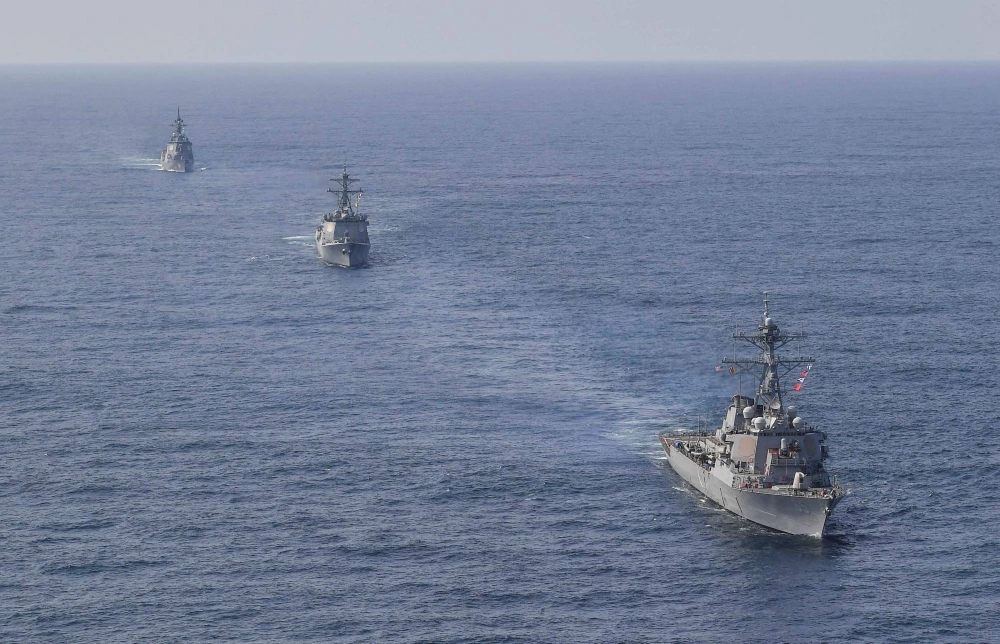 U.S., Japanese and South Korean navy destroyers take part in joint missile defense exercises in international waters between South Korea and Japan in April.  U.S., Japanese and South Korean navy destroyers take part in joint missile defense exercises in international waters between South Korea and Japan in April.