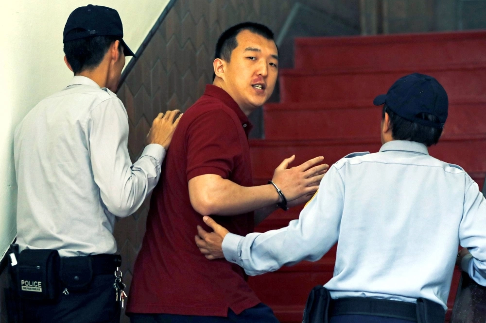 Mainland Chinese student Zhou Hongxu arrives for a court hearing on suspicion that he attempted to develop a spy network for China in Taiwan in March 2018.   Mainland Chinese student Zhou Hongxu arrives for a court hearing on suspicion that he attempted to develop a spy network for China in Taiwan in March 2018.