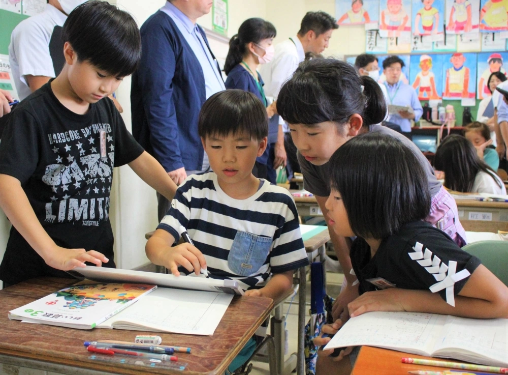 Students engage in group work during a class at Ogawara Elementary School in Ogawara, Miyagi Prefecture, in September. Students engage in group work during a class at Ogawara Elementary School in Ogawara, Miyagi Prefecture, in September.