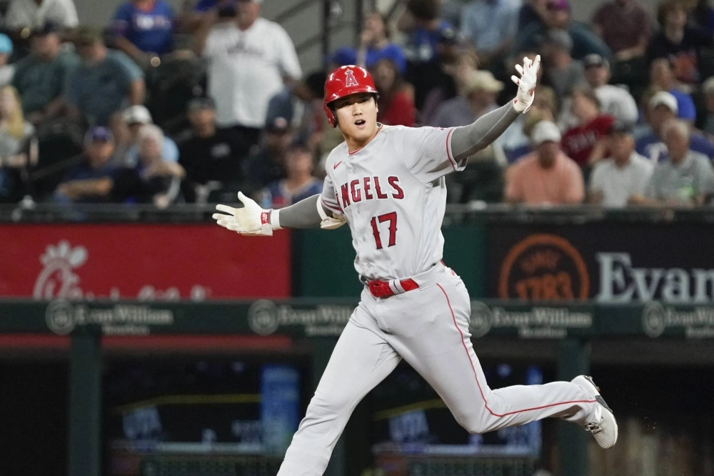 Angels designated hitter Shohei Ohtani rounds the bases after a go-ahead, two-run home run against the Rangers in Arlington, Texas, on June 12. Angels designated hitter Shohei Ohtani rounds the bases after a go-ahead, two-run home run against the Rangers in Arlington, Texas, on June 12.