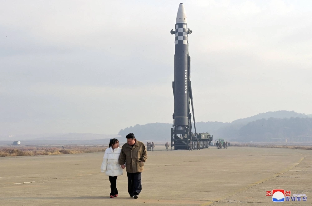 North Korean leader Kim Jong Un, along with his daughter, walks away from an intercontinental ballistic missile in this undated photo released on Nov. 19, 2022  North Korean leader Kim Jong Un, along with his daughter, walks away from an intercontinental ballistic missile in this undated photo released on Nov. 19, 2022