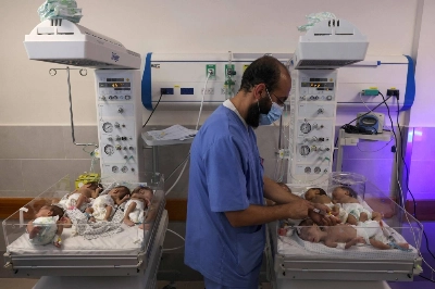 A Palestinian medic cares for premature babies evacuated from Shifa hospital to the Emirates hospital in Rafah in the southern Gaza Strip on Sunday. A Palestinian medic cares for premature babies evacuated from Shifa hospital to the Emirates hospital in Rafah in the southern Gaza Strip on Sunday.