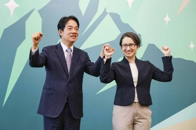 Taiwanese Vice President Lai Ching-te (left), presidential candidate from the Democratic Progressive Party, introduces Hsiao Bi-khim, Taiwan's de facto envoy to the United States, as his running mate in the 2024 election, during a news conference at Lai's campaign headquarters in Taipei on Monday. Taiwanese Vice President Lai Ching-te (left), presidential candidate from the Democratic Progressive Party, introduces Hsiao Bi-khim, Taiwan's de facto envoy to the United States, as his running mate in the 2024 election, during a news conference at Lai's campaign headquarters in Taipei on Monday.