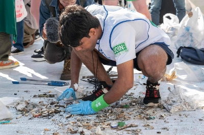 A member of the India team sorts through rubbish at the end of the first round of the Spogomi World Cup 2023 final, in which teams pick up as much rubbish as possible in a set amount of time, in Tokyo's Shibuya Ward on Wednesday.  A member of the India team sorts through rubbish at the end of the first round of the Spogomi World Cup 2023 final, in which teams pick up as much rubbish as possible in a set amount of time, in Tokyo's Shibuya Ward on Wednesday.