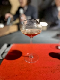 The last course is an espresso-based mocktail made with pomegranate concentrate, hibiscus cold brew and fermented white peach. | MELINDA JOE