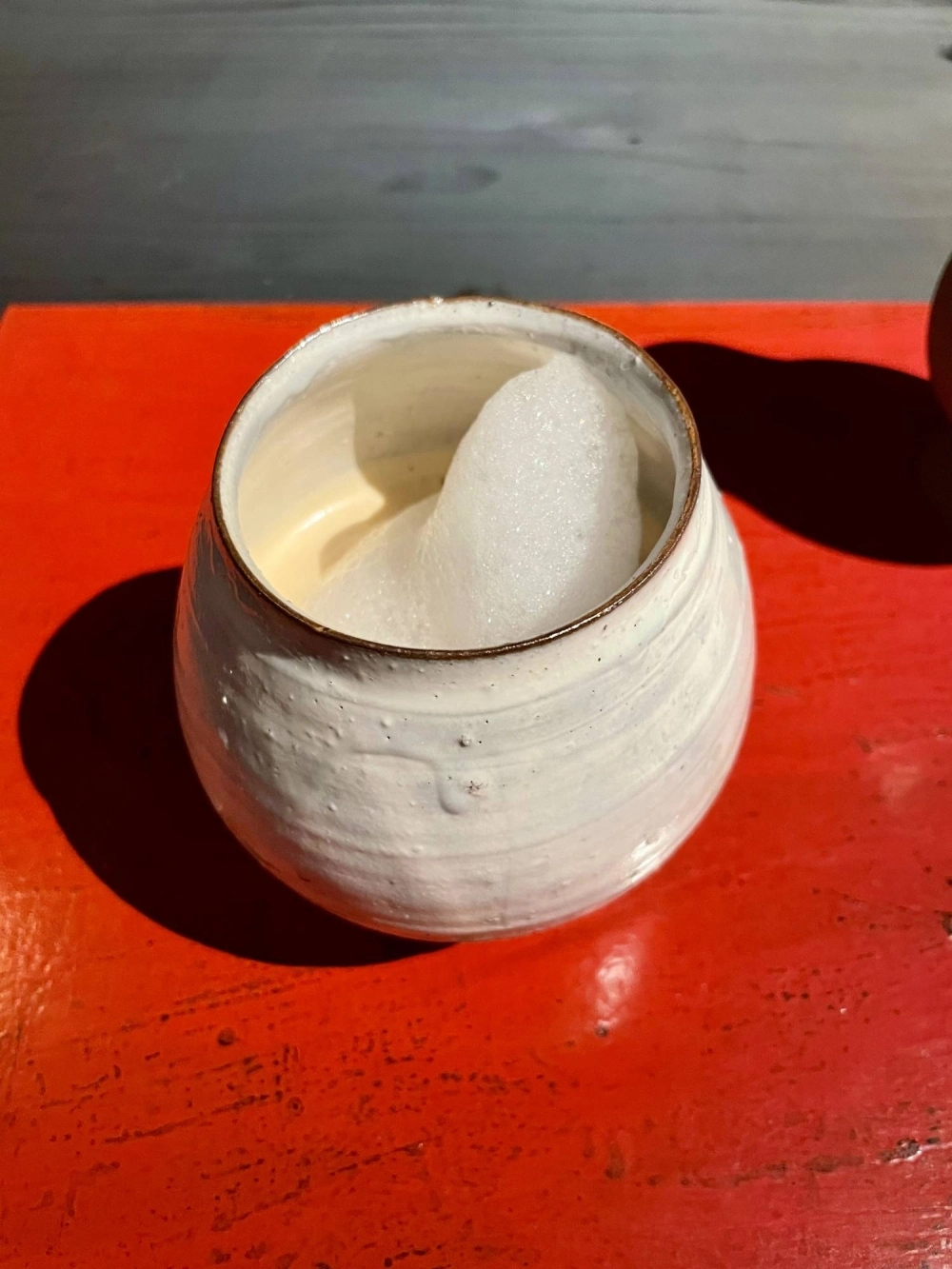Coffee flavored with a coconut-accented fig reduction and crowned with a foam of 'tachibana' citrus, juniper and 'sanshō' (Japanese pepper). Coffee flavored with a coconut-accented fig reduction and crowned with a foam of 'tachibana' citrus, juniper and 'sanshō' (Japanese pepper).