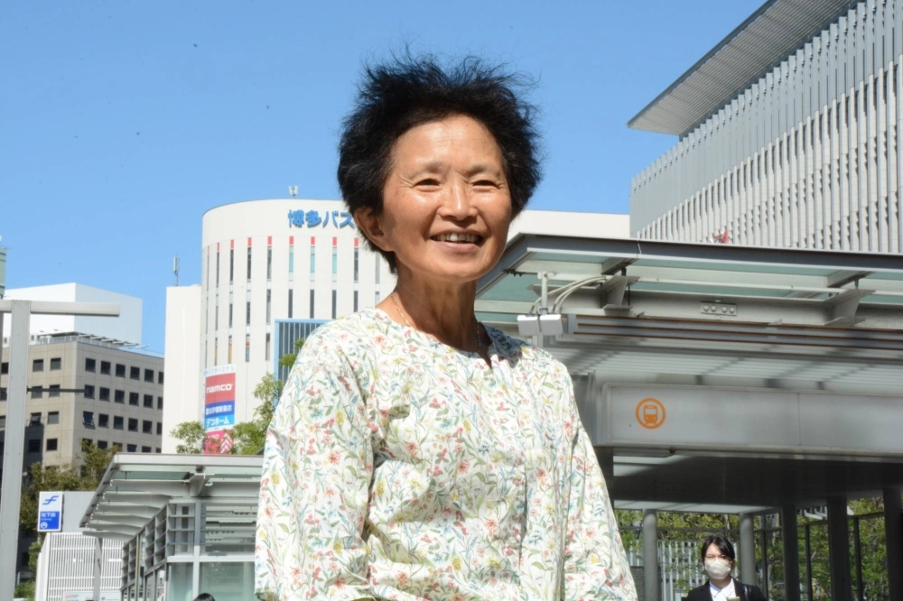 Yoko Huijs-Watanuki poses in the city of Fukuoka during a visit to Japan in October. Yoko Huijs-Watanuki poses in the city of Fukuoka during a visit to Japan in October.