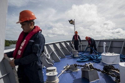 Philippine Coast Guard personnel patrol the South China Sea Philippine Coast Guard personnel patrol the South China Sea