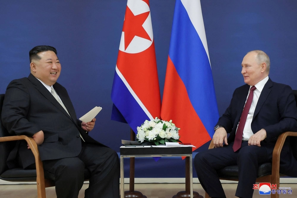 North Korean leader Kim Jong Un and Russian President Vladimir Putin attend a meeting at the Vostochny Cosmodrome in Russia's far eastern Amur region on Sept. 13. North Korean leader Kim Jong Un and Russian President Vladimir Putin attend a meeting at the Vostochny Cosmodrome in Russia's far eastern Amur region on Sept. 13.