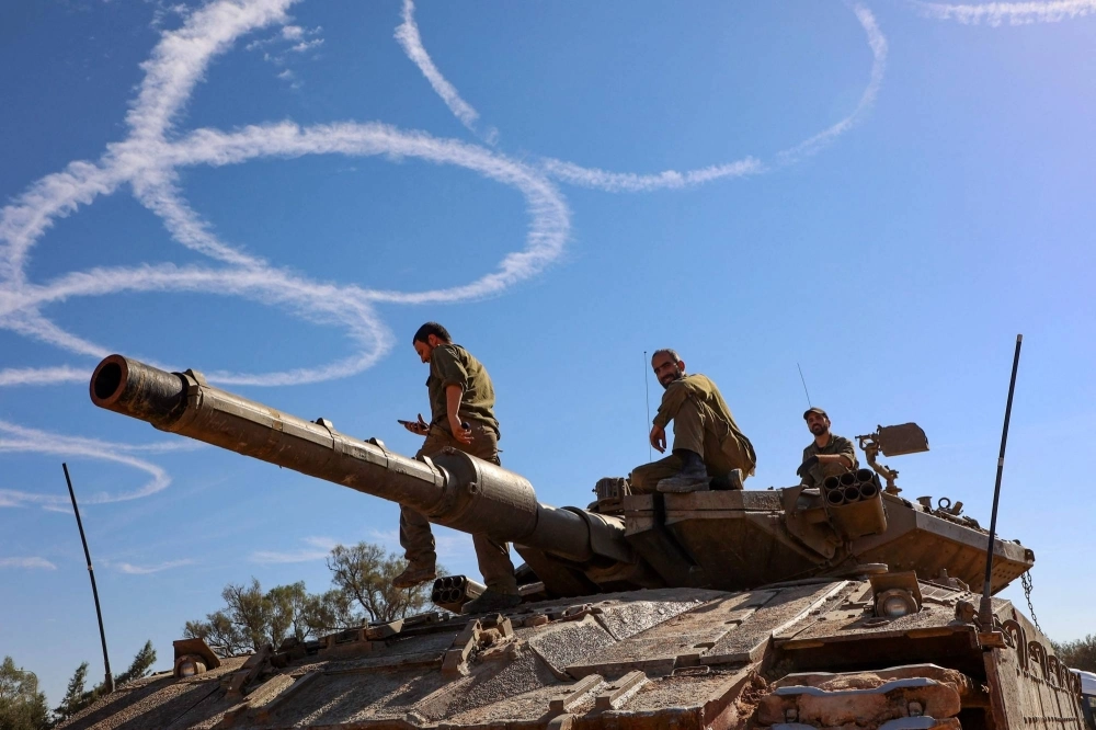 Israeli troops gather on the border with the Gaza Strip on Thursday, the 7th day of a truce with Hamas. Israeli troops gather on the border with the Gaza Strip on Thursday, the 7th day of a truce with Hamas.
