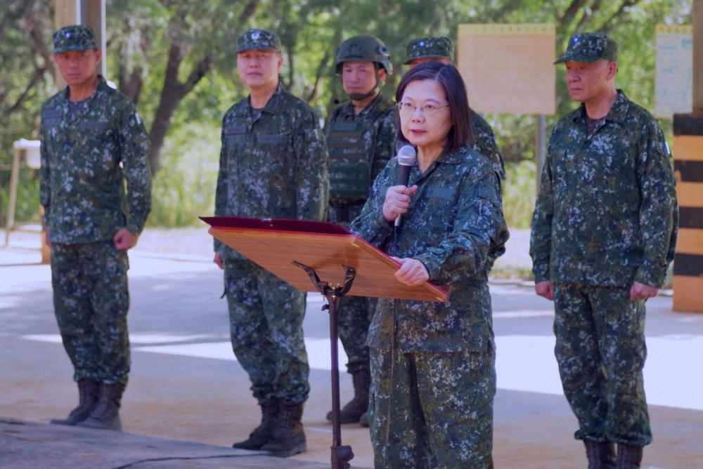 Taiwan President Tsai Ing-wen speaks to compulsory servicemen while inspecting a military base in Taichung on Nov. 23. Tsai is barred by term limits from seeking re-election. Taiwan President Tsai Ing-wen speaks to compulsory servicemen while inspecting a military base in Taichung on Nov. 23. Tsai is barred by term limits from seeking re-election.