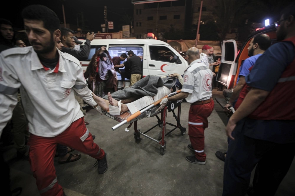 Injured Palestinians arrive at Nasser Hospital in Khan Younis, in the southern Gaza Strip, on Tuesday. Injured Palestinians arrive at Nasser Hospital in Khan Younis, in the southern Gaza Strip, on Tuesday.