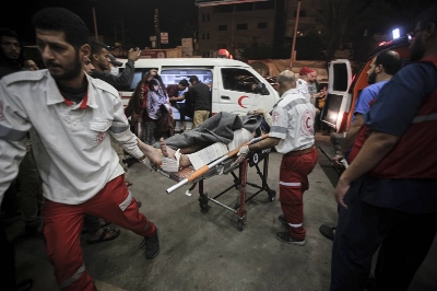 Injured Palestinians arrive at Nasser Hospital in Khan Younis, in the southern Gaza Strip, on Tuesday. Injured Palestinians arrive at Nasser Hospital in Khan Younis, in the southern Gaza Strip, on Tuesday.