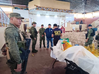 Local government and law enforcement officials view the scene of an explosion that occurred during a Catholic mass in a gymnasium at Mindanao State University in Marawi, Philippines, on Sunday. Local government and law enforcement officials view the scene of an explosion that occurred during a Catholic mass in a gymnasium at Mindanao State University in Marawi, Philippines, on Sunday.
