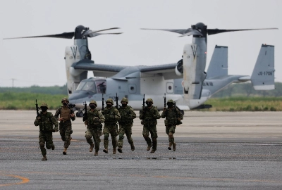 Ground Self-Defense Force personnel take part in a military drill involving a V-22 Osprey aircraft in June 2022.  Ground Self-Defense Force personnel take part in a military drill involving a V-22 Osprey aircraft in June 2022.