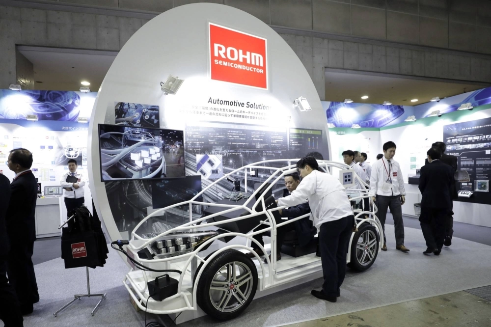 A seated attendee examines an automotive solution system using Rohm semiconductor products at the Automotive World 2018 forum in Tokyo in January 2018. A seated attendee examines an automotive solution system using Rohm semiconductor products at the Automotive World 2018 forum in Tokyo in January 2018.