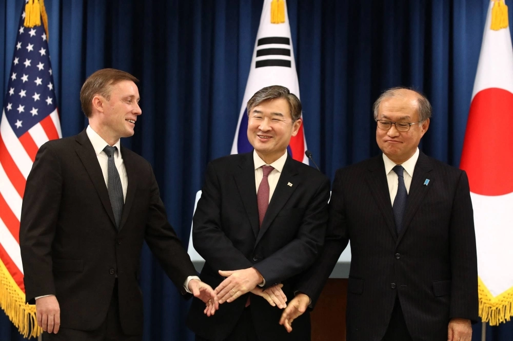 U.S. national security adviser Jake Sullivan (left), South Korean national security adviser Cho Tae-yong (center) and secretary-general of Japan's National Security Secretariat, Takeo Akiba, at a news conference in Seoul on Saturday.  U.S. national security adviser Jake Sullivan (left), South Korean national security adviser Cho Tae-yong (center) and secretary-general of Japan's National Security Secretariat, Takeo Akiba, at a news conference in Seoul on Saturday.