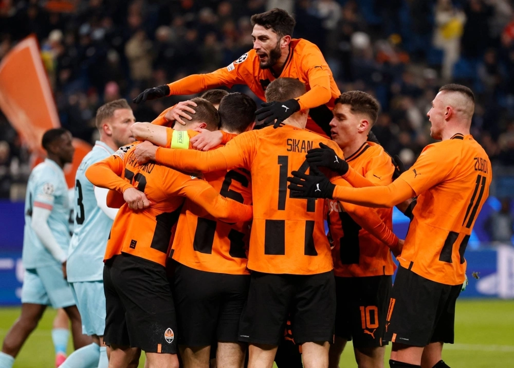 Shakhtar Donetsk players celebrate defender Mykola Matviyenko scoring the opening goal against Antwerp during a UEFA Champion's League Group H match in Hamburg on Nov. 28.  Shakhtar Donetsk players celebrate defender Mykola Matviyenko scoring the opening goal against Antwerp during a UEFA Champion's League Group H match in Hamburg on Nov. 28.