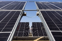 Wiring connects photovoltaic panels at the Al Dhafra Solar project, constructed by Electricite de France (EDF) and Jinko Power Technology, in Abu Dhabi, United Arab Emirates, in January. | Bloomberg