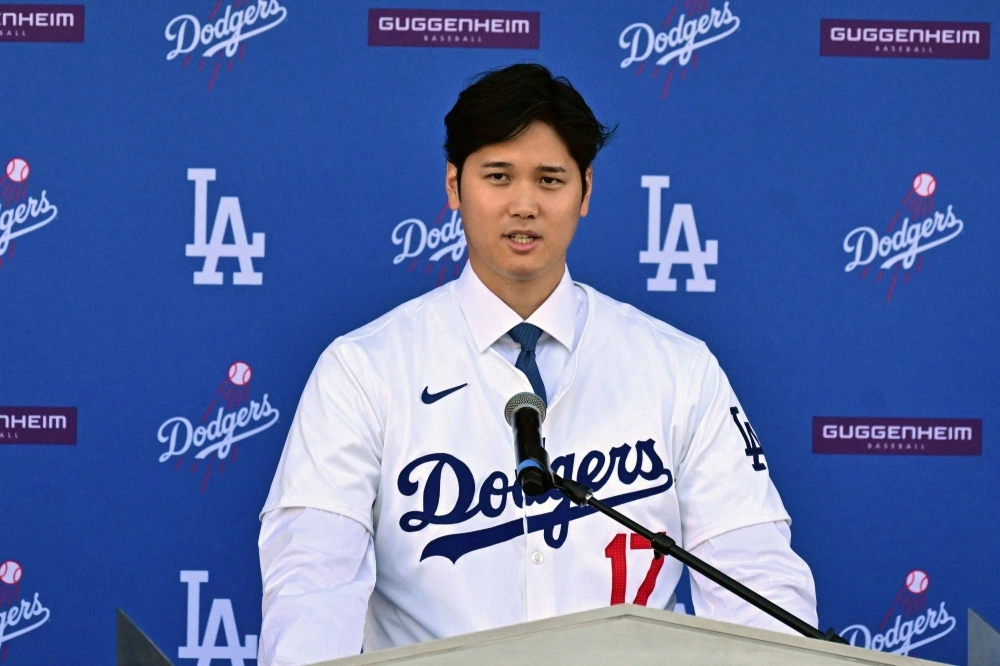 Baseball player Shohei Ohtani speaks during a news conference on his presentation after signing a 10-year deal with the Los Angeles Dodgers at Dodgers Stadium in Los Angeles, California, on Thursday. Baseball player Shohei Ohtani speaks during a news conference on his presentation after signing a 10-year deal with the Los Angeles Dodgers at Dodgers Stadium in Los Angeles, California, on Thursday.