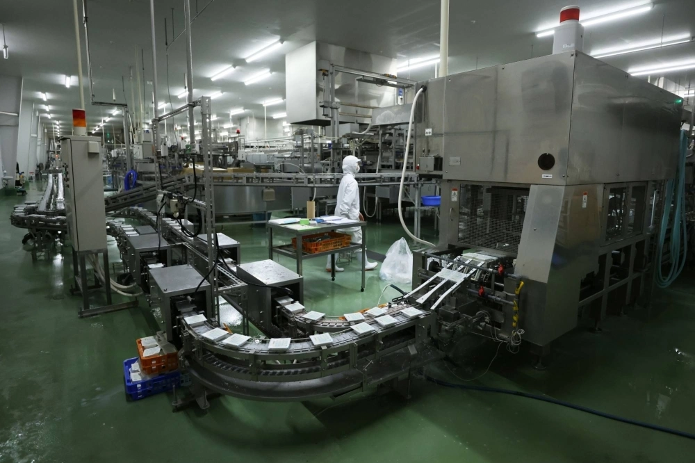 Packages of tofu on the production line at the Yamami factory in Oyama, Shizuoka Prefecture Packages of tofu on the production line at the Yamami factory in Oyama, Shizuoka Prefecture