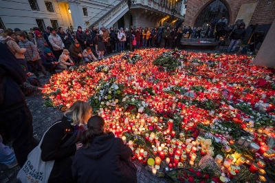 Well-wishers light candles as people mourn the lives lost in Thursday's mass shooting, outside Charles University in Prague on Friday.  Well-wishers light candles as people mourn the lives lost in Thursday's mass shooting, outside Charles University in Prague on Friday.