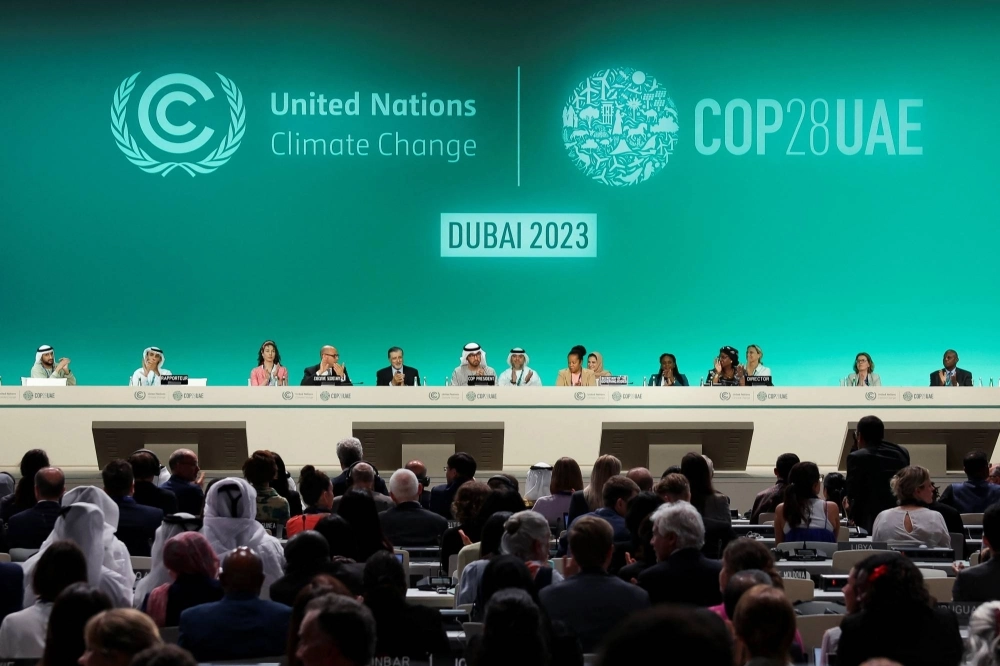 COP28 officials attend a plenary session in Dubai on Dec. 13. COP28 officials attend a plenary session in Dubai on Dec. 13.