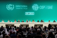 COP28 officials attend a plenary session in Dubai on Dec. 13. | Reuters
