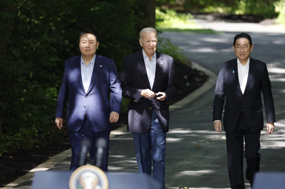 South Korean President Yoon Suk-yeol, U.S. President Joe Biden and Prime Minister Fumio Kishida arrive for a news conference during a trilateral summit at Camp David, Maryland, in the United States on Aug. 18. The three countries drew closer in 2023 amid growing concerns over North Korea and China. South Korean President Yoon Suk-yeol, U.S. President Joe Biden and Prime Minister Fumio Kishida arrive for a news conference during a trilateral summit at Camp David, Maryland, in the United States on Aug. 18. The three countries drew closer in 2023 amid growing concerns over North Korea and China.