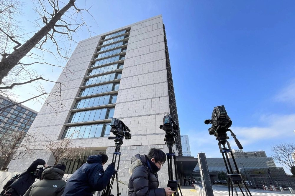 Reporters gather in front of the Upper House parliamentary building on Thursday in Tokyo. Prosecutors raided LDP lawmaker Yasutada Ono's office, which is located in the building, the same day. Reporters gather in front of the Upper House parliamentary building on Thursday in Tokyo. Prosecutors raided LDP lawmaker Yasutada Ono's office, which is located in the building, the same day.