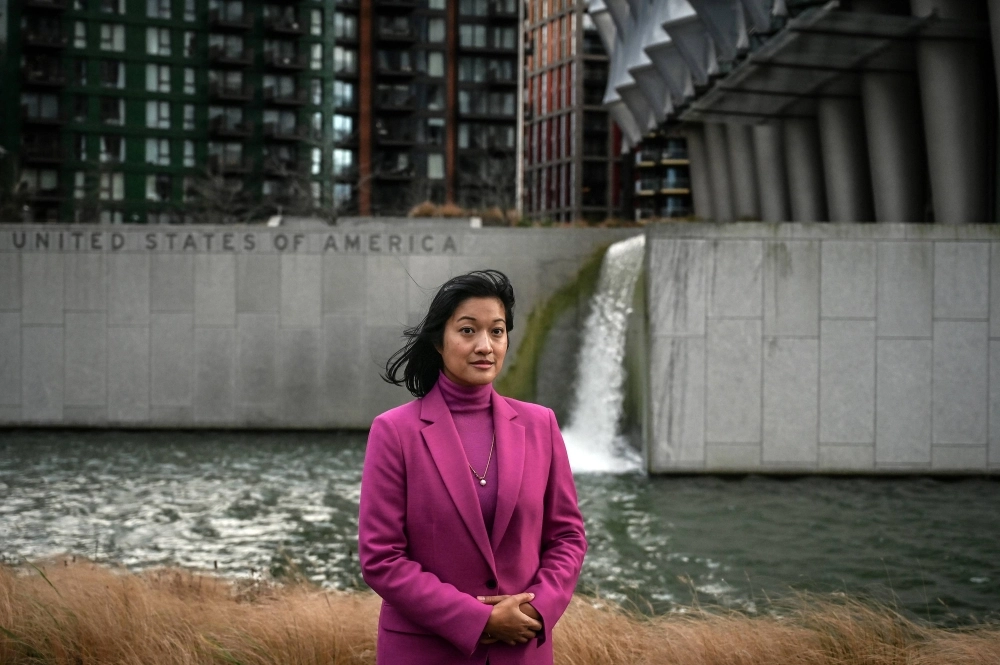 Yuki Kondo-Shah beside the U.S. Embassy where she works in London on Dec. 22. As U.S.-China tensions rise, national security employees with ties to Asia say U.S. counterintelligence officers wrongly regard them as potential spies and unfairly ban them from jobs.  Yuki Kondo-Shah beside the U.S. Embassy where she works in London on Dec. 22. As U.S.-China tensions rise, national security employees with ties to Asia say U.S. counterintelligence officers wrongly regard them as potential spies and unfairly ban them from jobs.