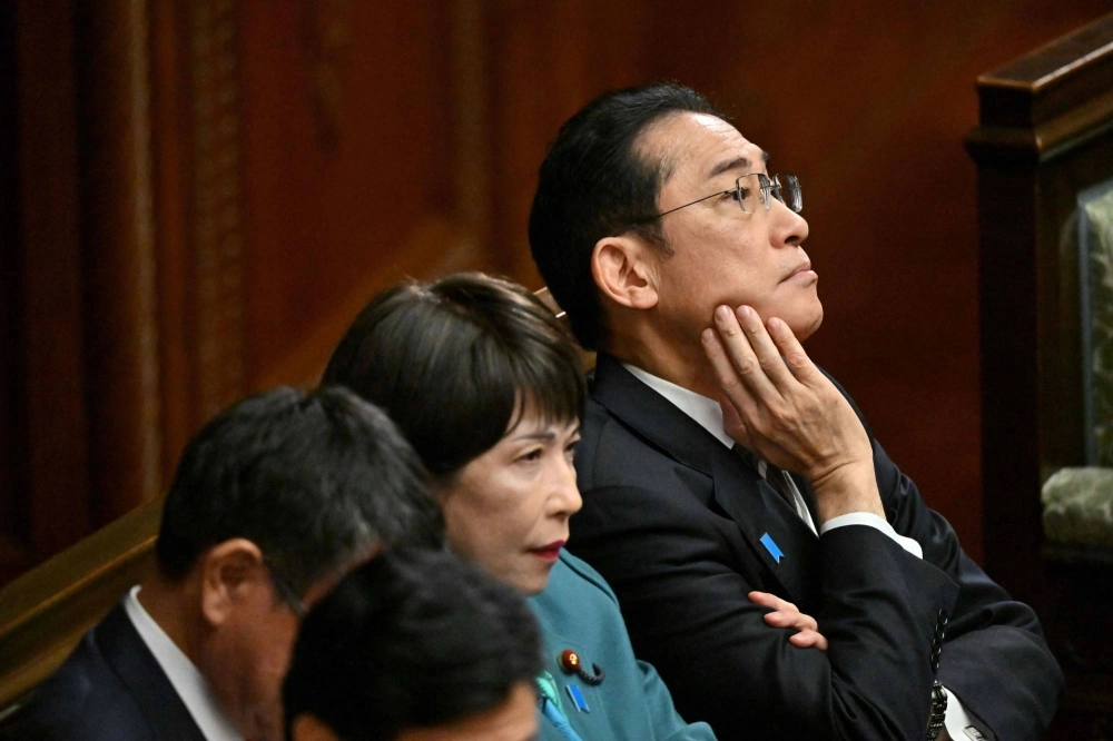 Prime Minister Fumio Kishida awaits the results of a no-confidence vote against his Cabinet in the country's parliament on Dec. 13. Prime Minister Fumio Kishida awaits the results of a no-confidence vote against his Cabinet in the country's parliament on Dec. 13.