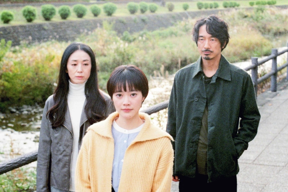 Haru (An Ogawa, center) searches for the origin of a recording left by her late mother, while keeping a watchful eye over two older acquaintances, in “Following the Sound.” Haru (An Ogawa, center) searches for the origin of a recording left by her late mother, while keeping a watchful eye over two older acquaintances, in “Following the Sound.”