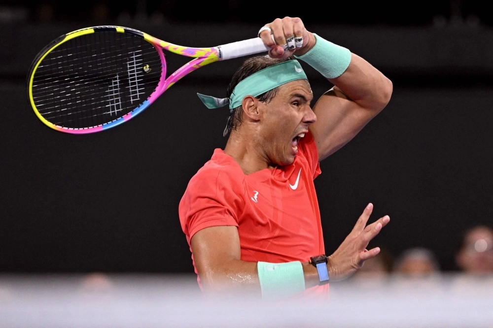 Spain's Rafael Nadal hits a return against Austria's Dominic Thiem during his match in Brisbane on Jan. 2.  Spain's Rafael Nadal hits a return against Austria's Dominic Thiem during his match in Brisbane on Jan. 2.