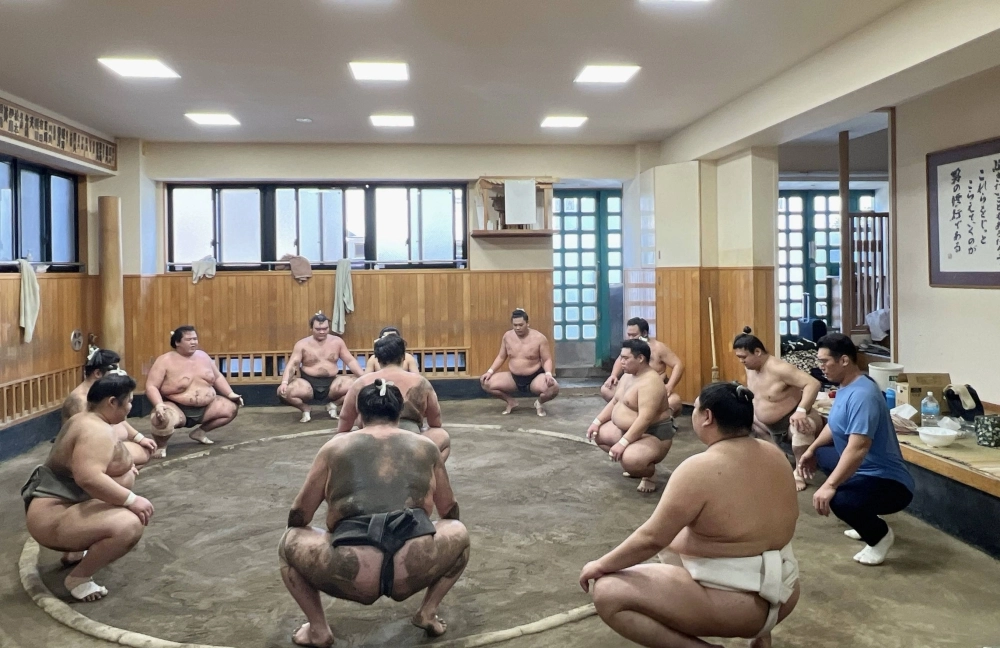 Wrestlers with the Shikoroyama stable after a training session in Tokyo late last month.  Wrestlers with the Shikoroyama stable after a training session in Tokyo late last month.