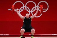 Laurel Hubbard of New Zealand, the first openly transgender female Olympian, competes at the Tokyo Games in August 2021.  | Reuters