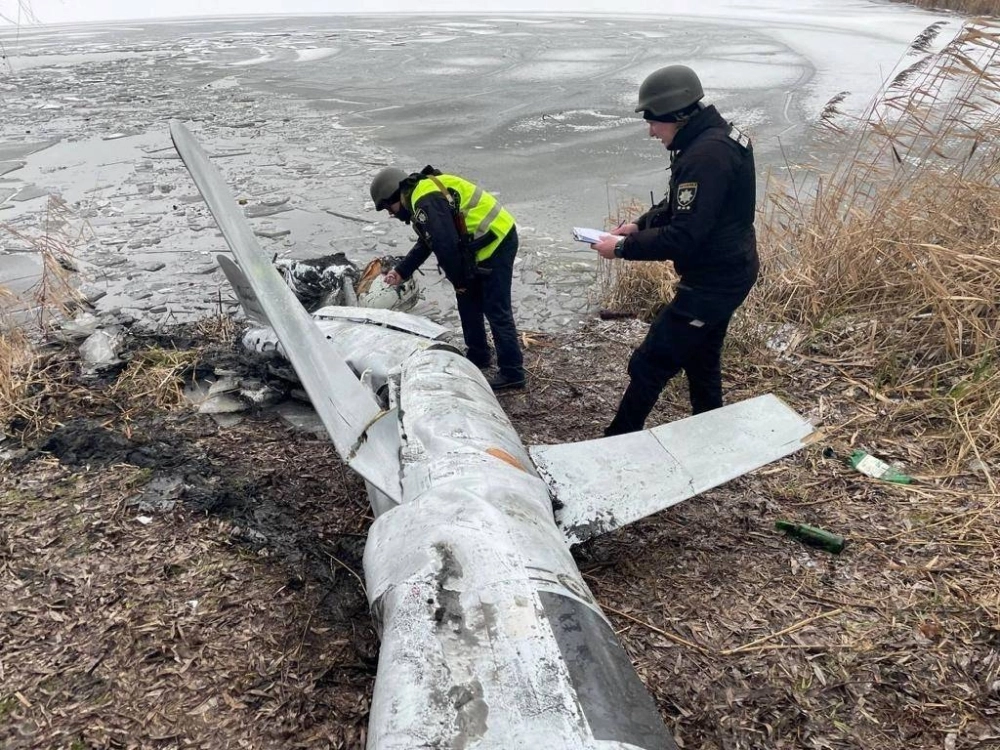 Ukrainian officials inspect a Russian cruise missile shot down near Kyiv in January 2023. Ukrainian officials inspect a Russian cruise missile shot down near Kyiv in January 2023.