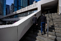 Office workers in the Central district in Hong Kong on Nov. 20 | Bloomberg