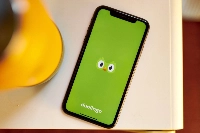 The logo of language-learning app, Duolingo, on a smartphone  | Bloomberg