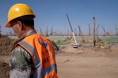 A China Railway employee works at the construction site for the Xiongan station of a new railway connecting Beijing to the area in Hebei province, China, in March 2019. In his annual new year speech, Chinese President Xi Jinping trumpeted the city’s progress saying it was "growing fast” and helping to revitalize northeastern China.  A China Railway employee works at the construction site for the Xiongan station of a new railway connecting Beijing to the area in Hebei province, China, in March 2019. In his annual new year speech, Chinese President Xi Jinping trumpeted the city’s progress saying it was "growing fast” and helping to revitalize northeastern China.