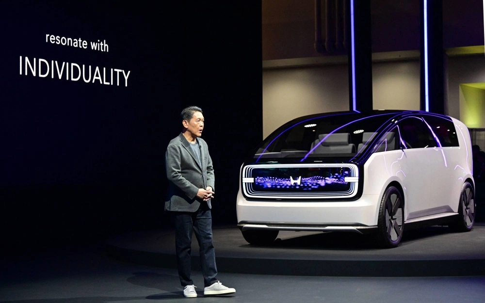Shinji Aoyama, Honda's chief director of North America, unveils its electric vehicle concept Space-Hub during the CES trade show in Las Vegas on Tuesday. Shinji Aoyama, Honda's chief director of North America, unveils its electric vehicle concept Space-Hub during the CES trade show in Las Vegas on Tuesday.
