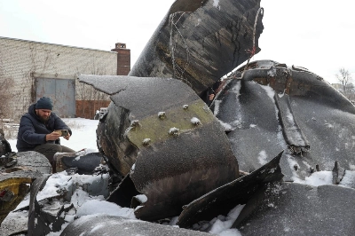 A man photographs parts of an unidentified missile on Saturday, which Ukrainian authorities believe to have been made in North Korea and which was used in a strike in Kharkiv earlier this week. A man photographs parts of an unidentified missile on Saturday, which Ukrainian authorities believe to have been made in North Korea and which was used in a strike in Kharkiv earlier this week.