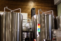 Where children once played tag in Mosetsuri Elementary School's gymnasium, Brassiere Knot's towering vats for brewing and fermenting now stand. | JUSTIN RANDALL