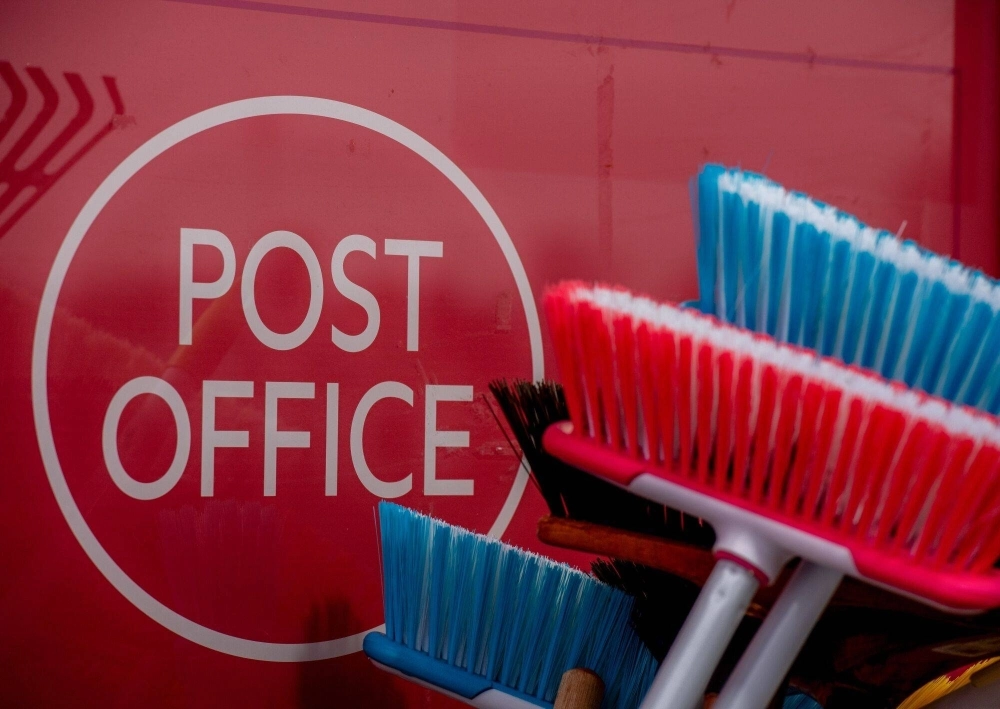 A Post Office sign at a branch in a local convenience store near Ascot, England, on Friday. The Post Office scandal, where some 980 U.K. Post Office workers were wrongfully convicted of theft and false accounting, was triggered by faults in a Fujitsu computer system called Horizon that was used by U.K. Post Offices and inaccurately reported shortfalls in their accounts, resulting in private prosecutions of innocent branch managers for theft.  A Post Office sign at a branch in a local convenience store near Ascot, England, on Friday. The Post Office scandal, where some 980 U.K. Post Office workers were wrongfully convicted of theft and false accounting, was triggered by faults in a Fujitsu computer system called Horizon that was used by U.K. Post Offices and inaccurately reported shortfalls in their accounts, resulting in private prosecutions of innocent branch managers for theft.