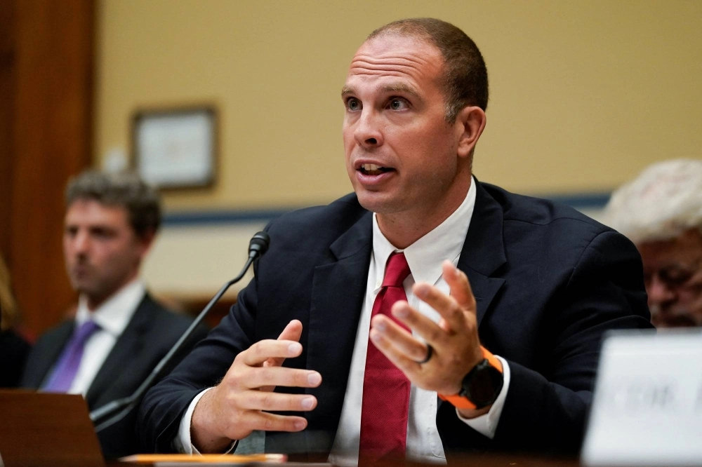 David Grusch, former National Reconnaissance Office representative on the Defense Department's Unidentified Aerial Phenomena Task Force, testifies during a House subcommittee's hearing on Capitol Hill in Washington last July. David Grusch, former National Reconnaissance Office representative on the Defense Department's Unidentified Aerial Phenomena Task Force, testifies during a House subcommittee's hearing on Capitol Hill in Washington last July.