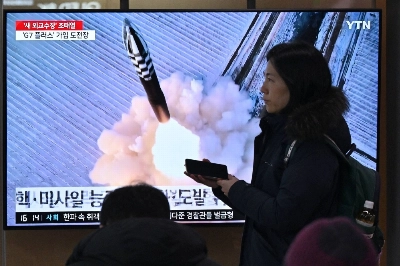 People watch a television screen showing  file footage of a North Korean missile test, at the main railway station in Seoul on Sunday. People watch a television screen showing  file footage of a North Korean missile test, at the main railway station in Seoul on Sunday.
