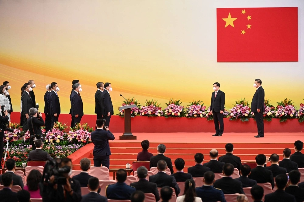 Chinese President Xi Jinping and Hong Kong's new chief executive, John Lee, take part in a swearing in ceremony to inaugurate the city's new government on July 1, 2022. Chinese President Xi Jinping and Hong Kong's new chief executive, John Lee, take part in a swearing in ceremony to inaugurate the city's new government on July 1, 2022.