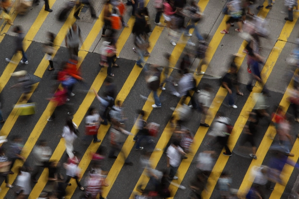 People cross a street in the Mong Kok district in Hong Kong in 2011. People cross a street in the Mong Kok district in Hong Kong in 2011.