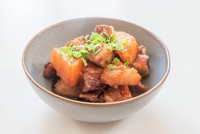 The recipe combines daikon with pork belly for a traditional style simmered dish with a twist. The recipe combines daikon with pork belly for a traditional style simmered dish with a twist.