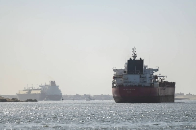 A ship transits the Suez Canal toward the Red Sea on Jan. 10. Insurance costs for ships whose seafarers who do brave the waterway have shot up tenfold, including a large increase since the airstrikes. A ship transits the Suez Canal toward the Red Sea on Jan. 10. Insurance costs for ships whose seafarers who do brave the waterway have shot up tenfold, including a large increase since the airstrikes.